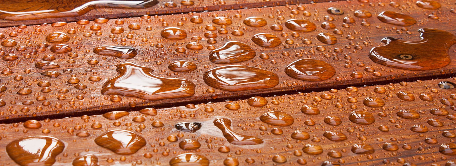 Close Up of Water Droplets Forming of Oiled Timber