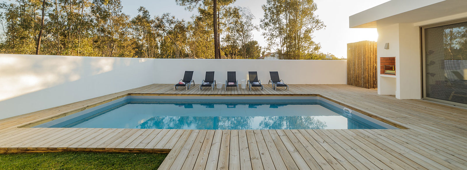 Backyard Deck with Pool and Pool Chairs